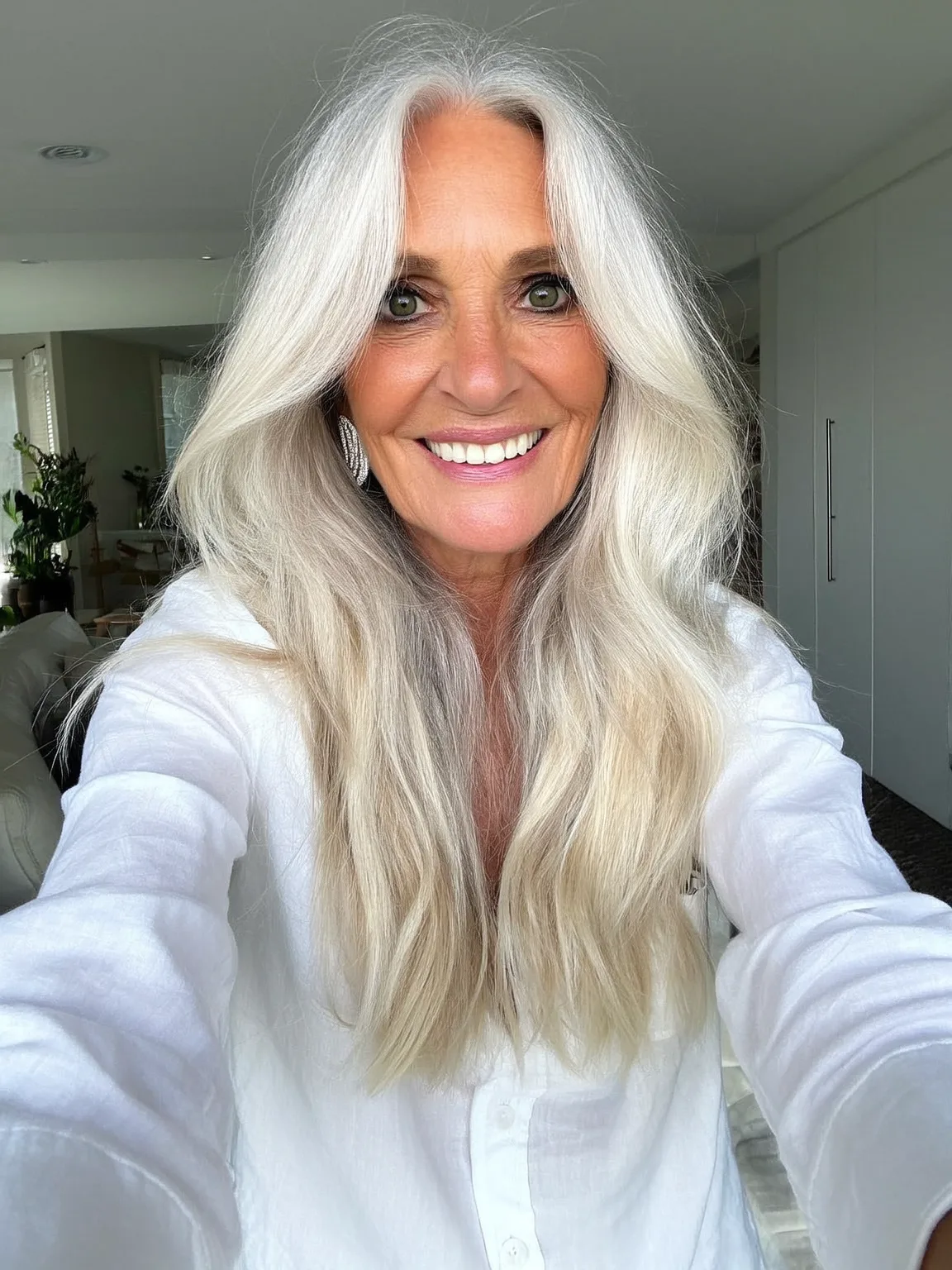 Loose Wavy Silver Blonde Layers with Curtain Bangs